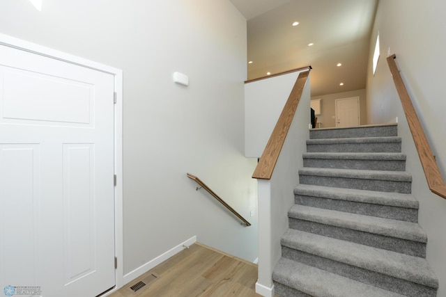 stairway with wood-type flooring