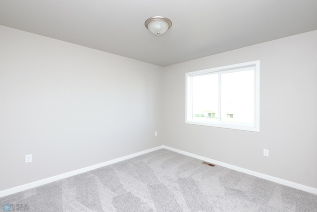 empty room with carpet flooring