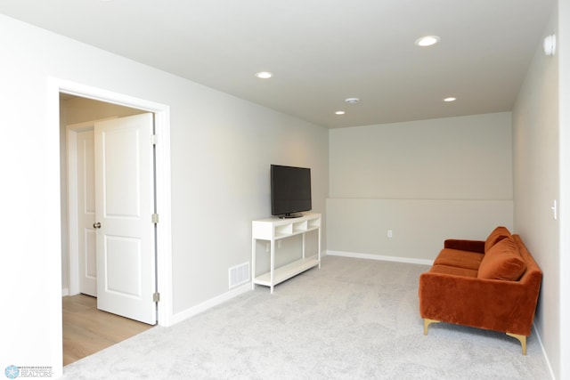 sitting room with light carpet