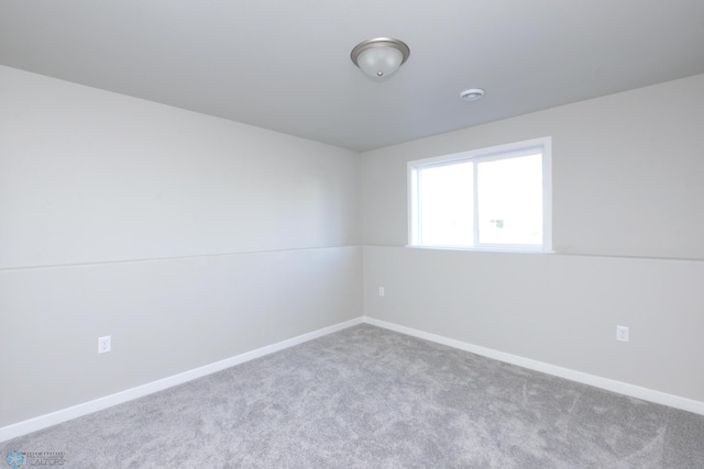 spare room with light carpet