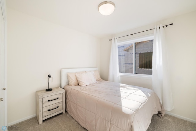 bedroom with light carpet