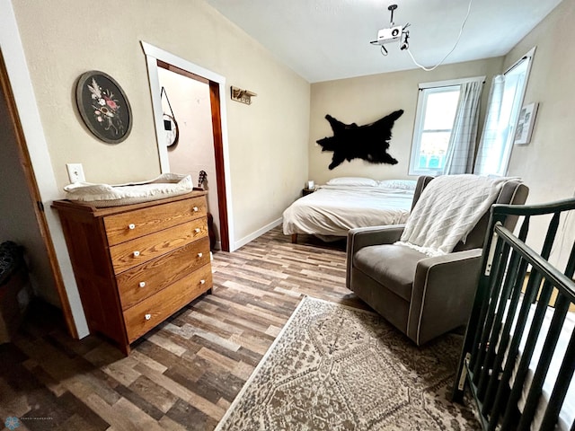 bedroom with wood-type flooring