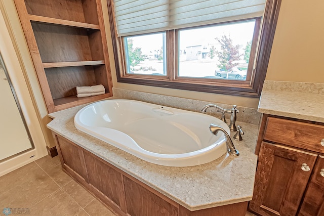 bathroom featuring tile patterned flooring and a bathing tub