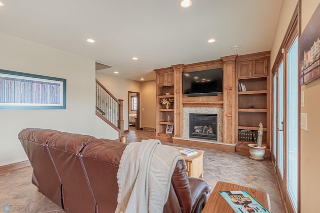 living room featuring built in shelves