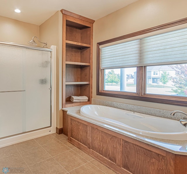 bathroom featuring separate shower and tub and tile patterned floors