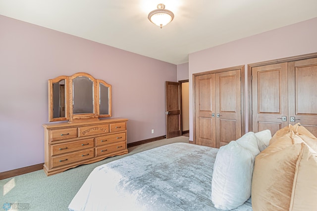 bedroom featuring light colored carpet