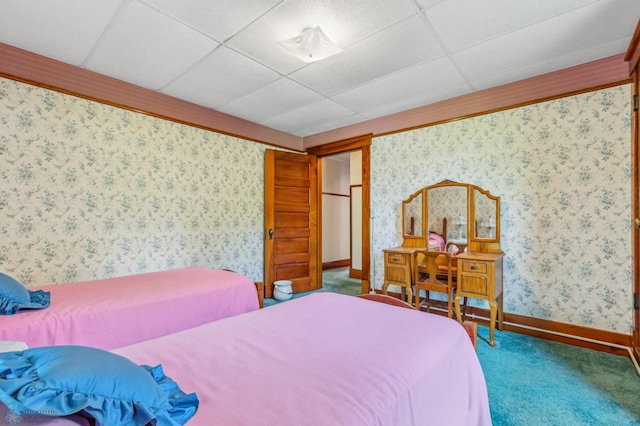 bedroom featuring a paneled ceiling and carpet