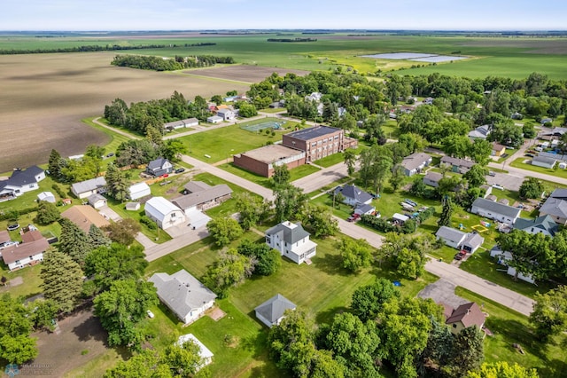 birds eye view of property featuring a water view and a rural view