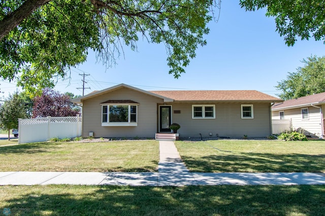 single story home with a front yard