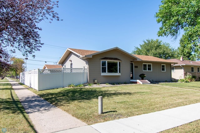 ranch-style house featuring a front lawn