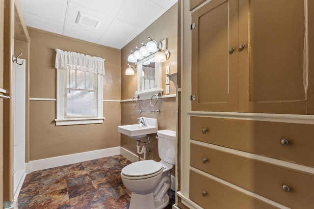 bathroom featuring sink and toilet