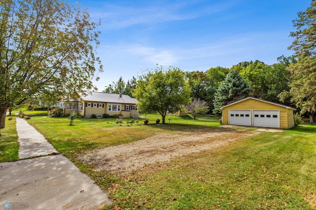 view of yard featuring an outbuilding and a garage