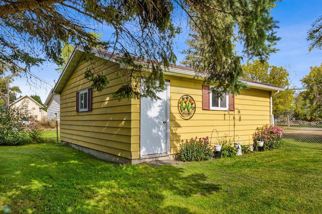 view of property exterior with a lawn