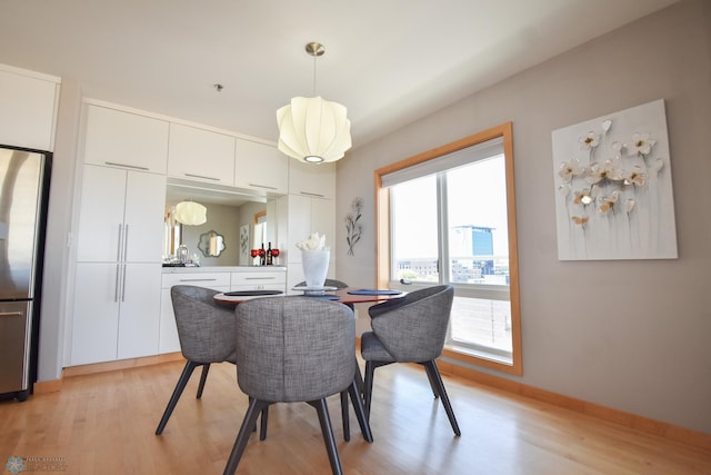 dining room with light hardwood / wood-style floors