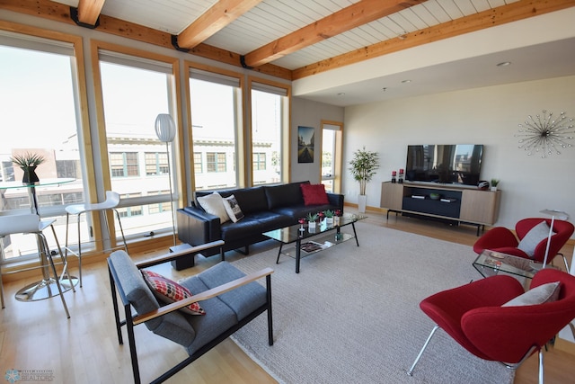 living room featuring light hardwood / wood-style floors, beamed ceiling, and wooden ceiling