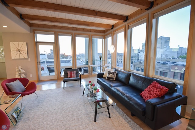 sunroom featuring beamed ceiling