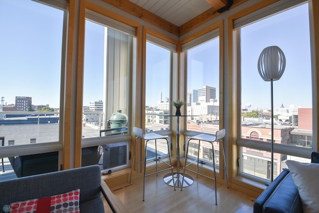 sunroom / solarium with wood ceiling and a wealth of natural light