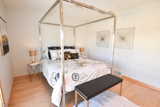 bedroom featuring wood-type flooring