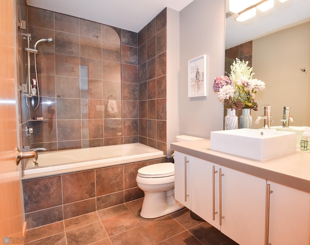 full bathroom with tile patterned flooring, vanity, toilet, and tiled shower / bath