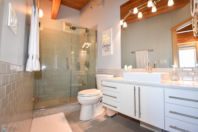 bathroom featuring tile walls, a shower with shower door, vanity, and toilet