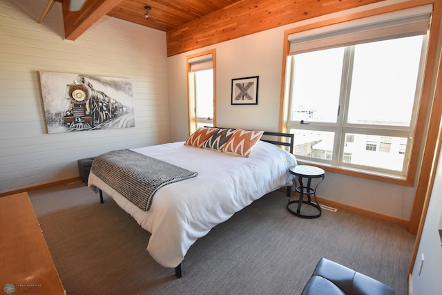 bedroom with wood ceiling and beam ceiling