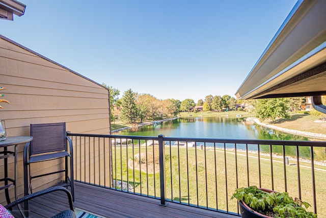 deck featuring a yard and a water view