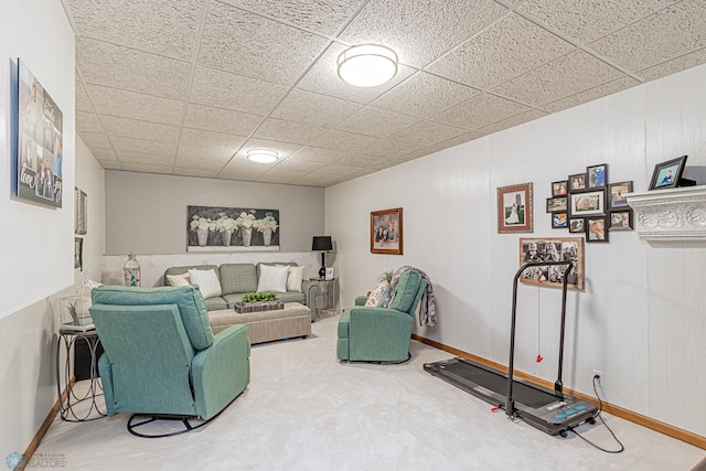 living room with a paneled ceiling