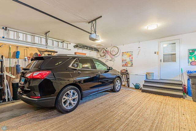 garage featuring a garage door opener