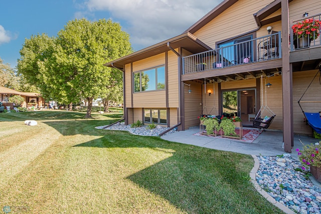 exterior space with a patio and a yard