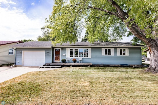 ranch-style home featuring a front yard and a garage