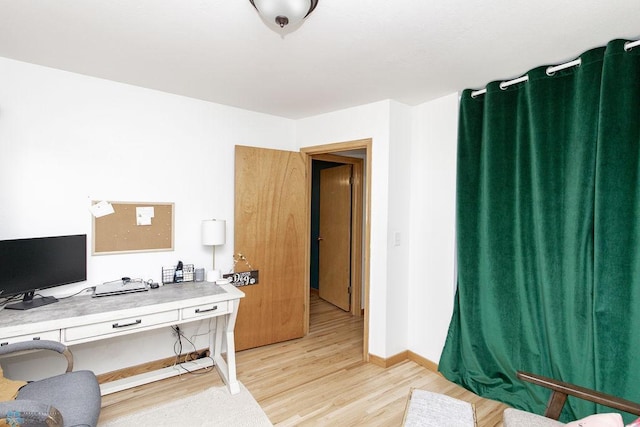 office area with light hardwood / wood-style flooring