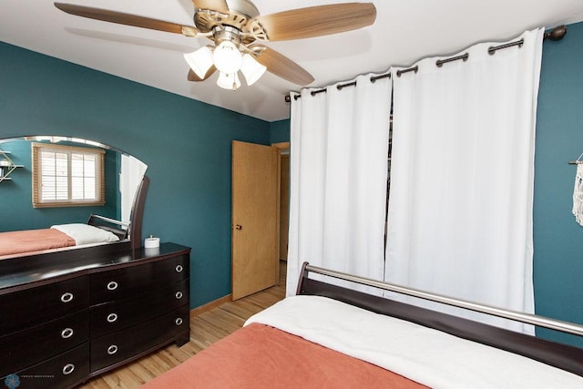 bedroom featuring ceiling fan and light hardwood / wood-style flooring