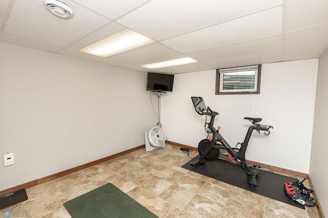 workout room with a paneled ceiling