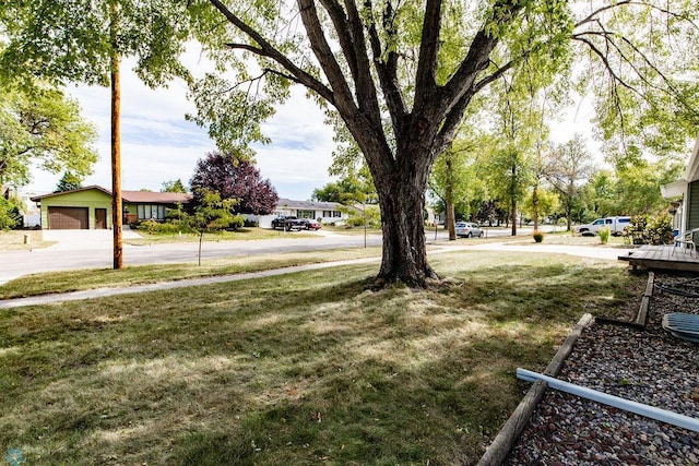 view of yard featuring a garage