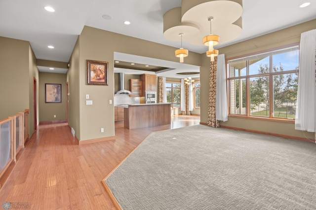 unfurnished living room with light wood-type flooring