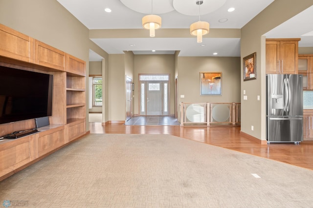 unfurnished living room featuring light hardwood / wood-style floors