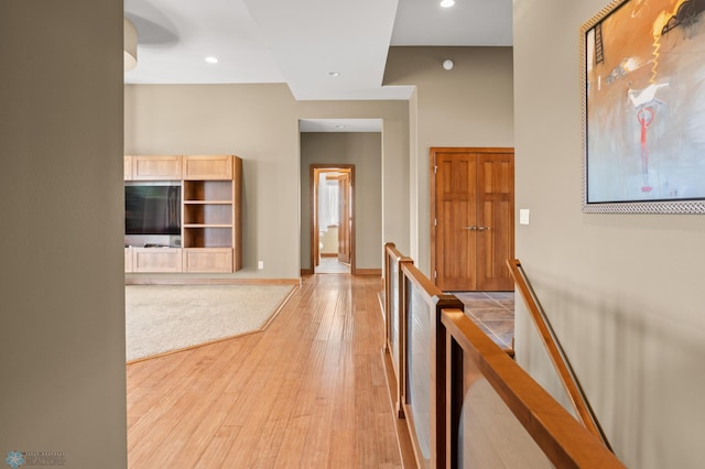 hall with light hardwood / wood-style floors