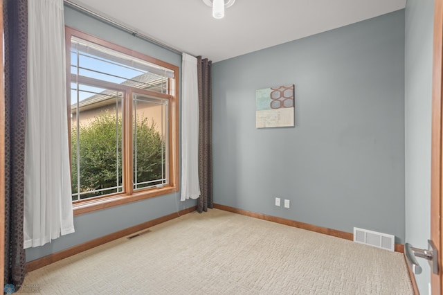 spare room featuring carpet flooring