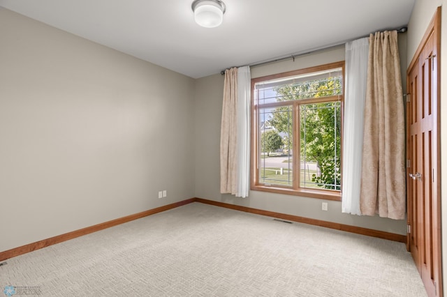 empty room featuring carpet flooring