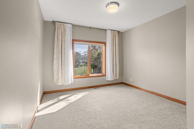 unfurnished room with carpet