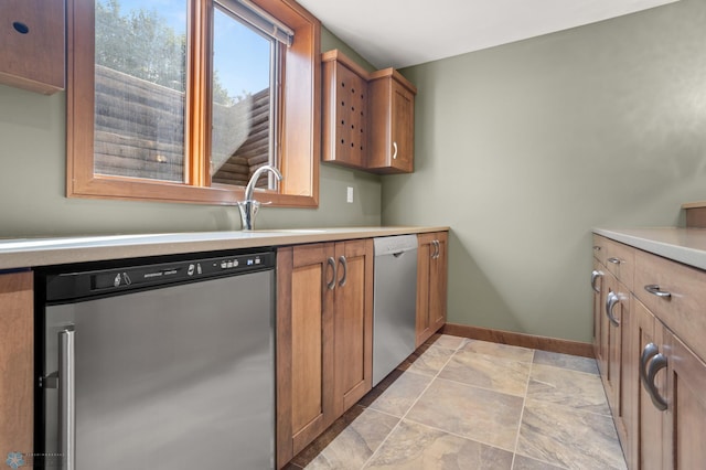 kitchen featuring stainless steel dishwasher and sink