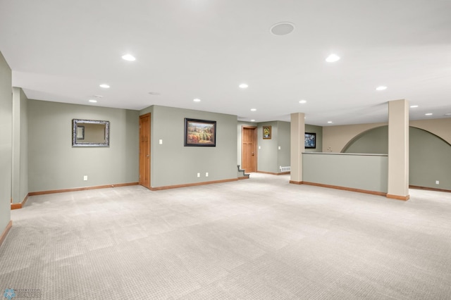 empty room featuring light colored carpet