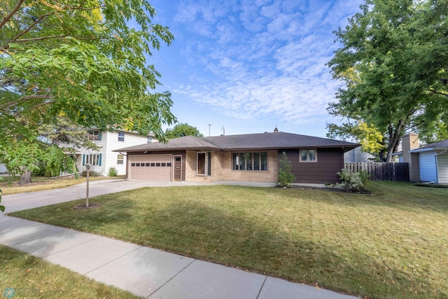 view of front of property with a garage and a front yard