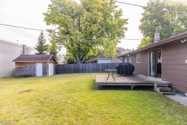 view of yard with a deck and a shed