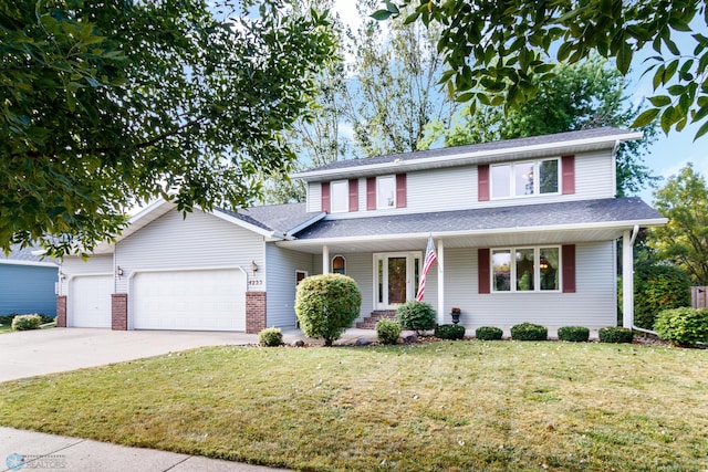 front of property with a garage, a porch, and a front yard