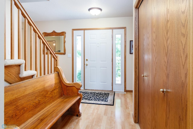 foyer featuring a healthy amount of sunlight and light hardwood / wood-style flooring