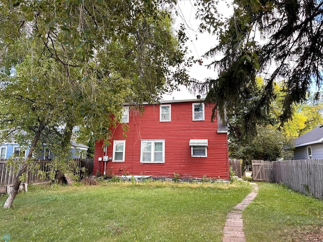 view of side of property with a yard