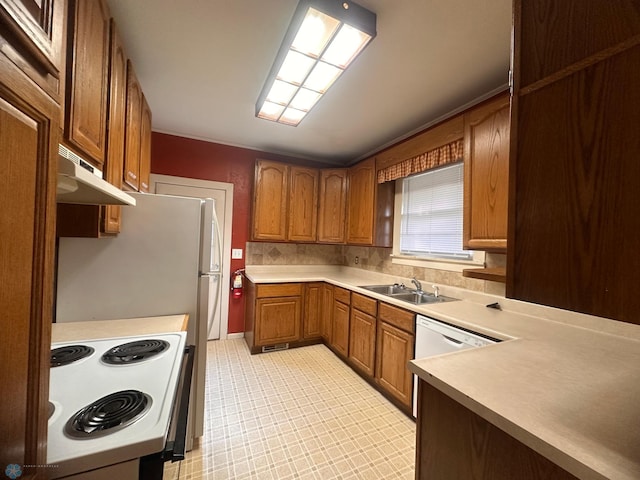 kitchen with electric stove and sink