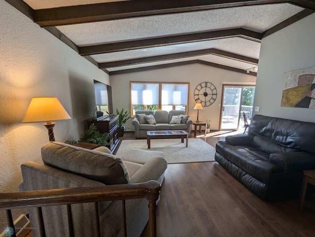 living room with vaulted ceiling with beams, hardwood / wood-style floors, a textured ceiling, and a healthy amount of sunlight