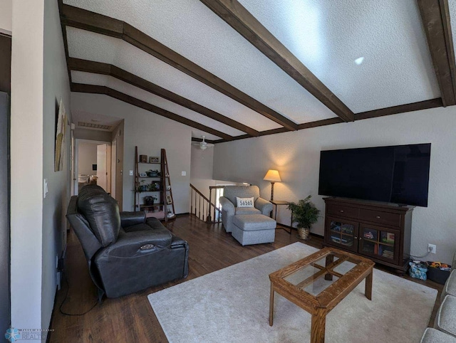 living room featuring lofted ceiling with beams and hardwood / wood-style floors